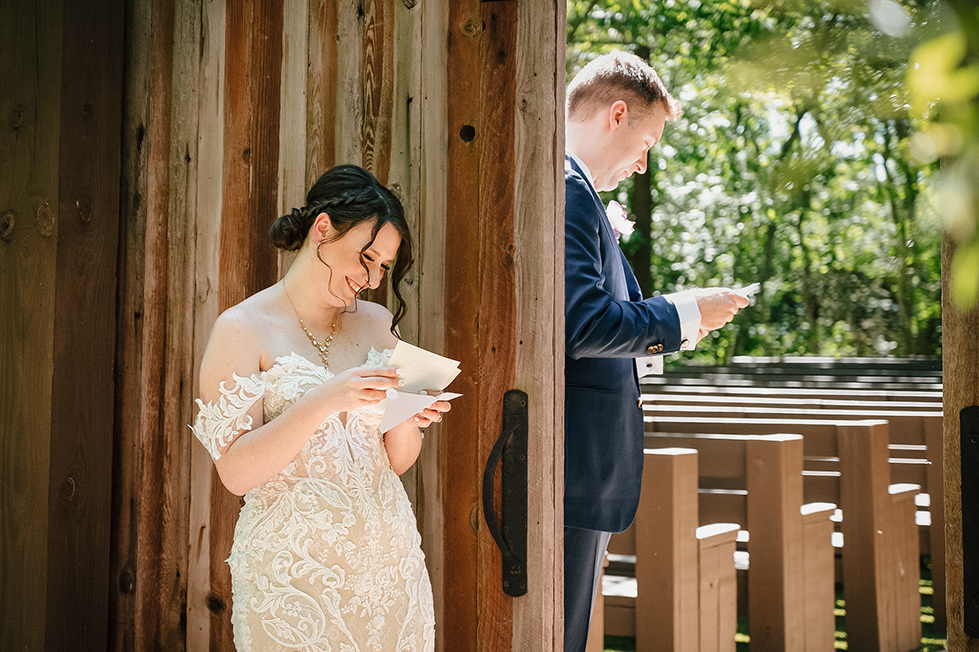 Bride and groom reading personal letters at first touch, Magnolia Bells conroe TX