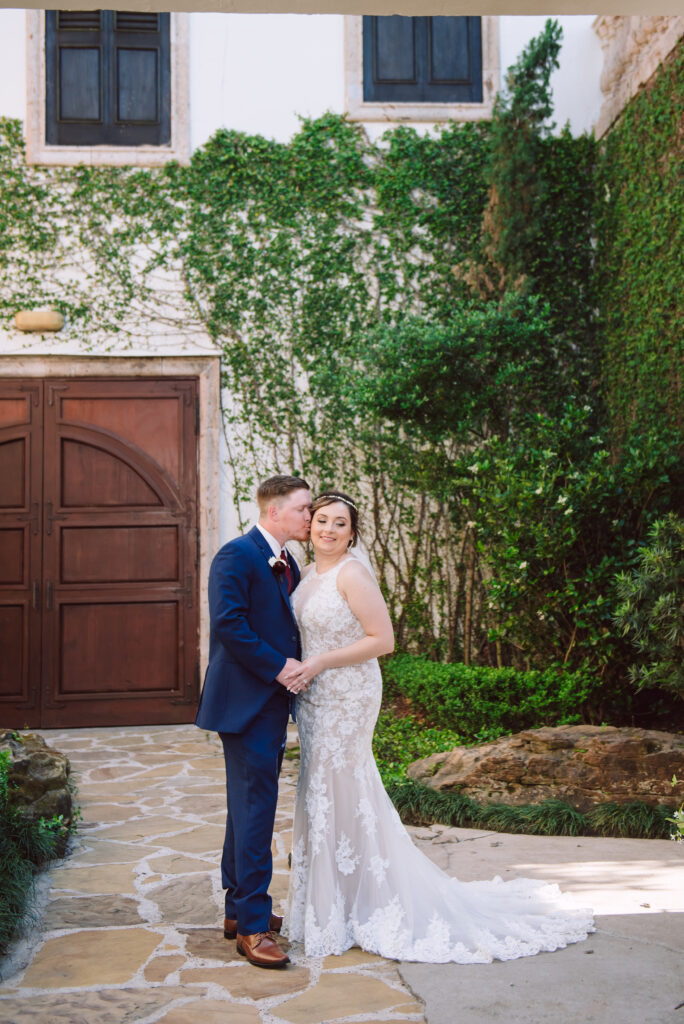Bride and groom portrait in courtyard at bell tower on 34th 